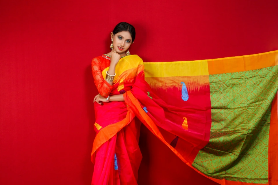 woman in yellow and red sari dress